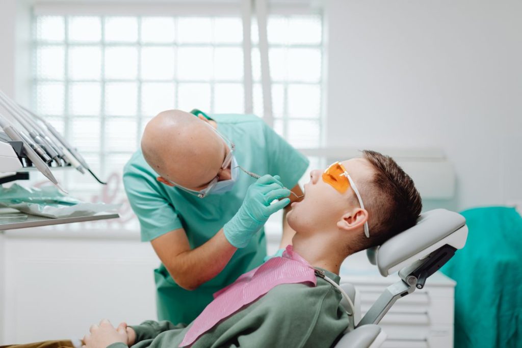 Dentist performing a checkup on a patient